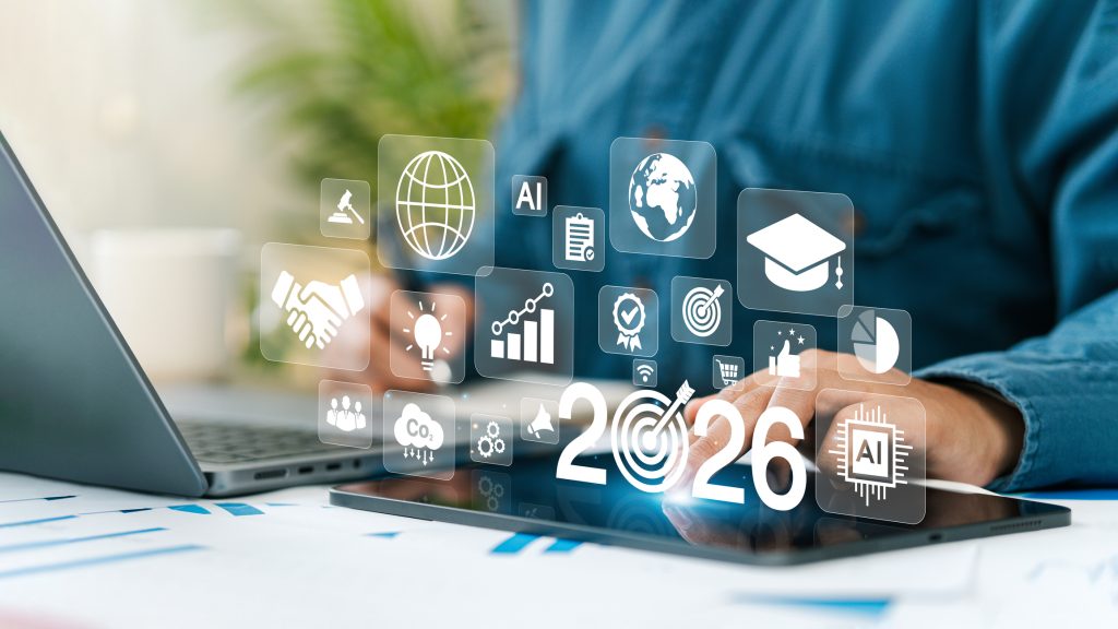 New Year 2026 Business Goals Concept. Businessman tapping 2026 goal icon on virtual screen. Goal analysis, finance, success planning strategy. Plans and visions for 2026. Business growth.